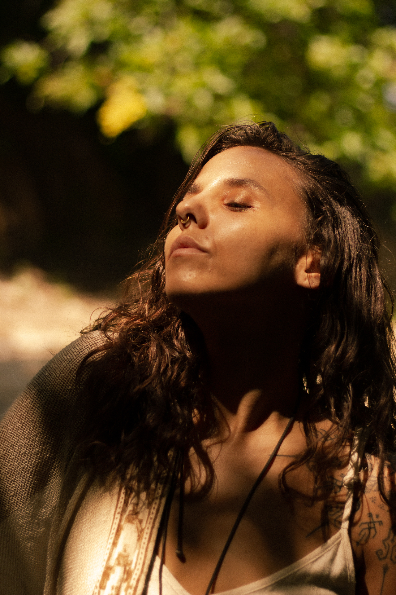 René with eyes closed, bathed in soft golden sunlight