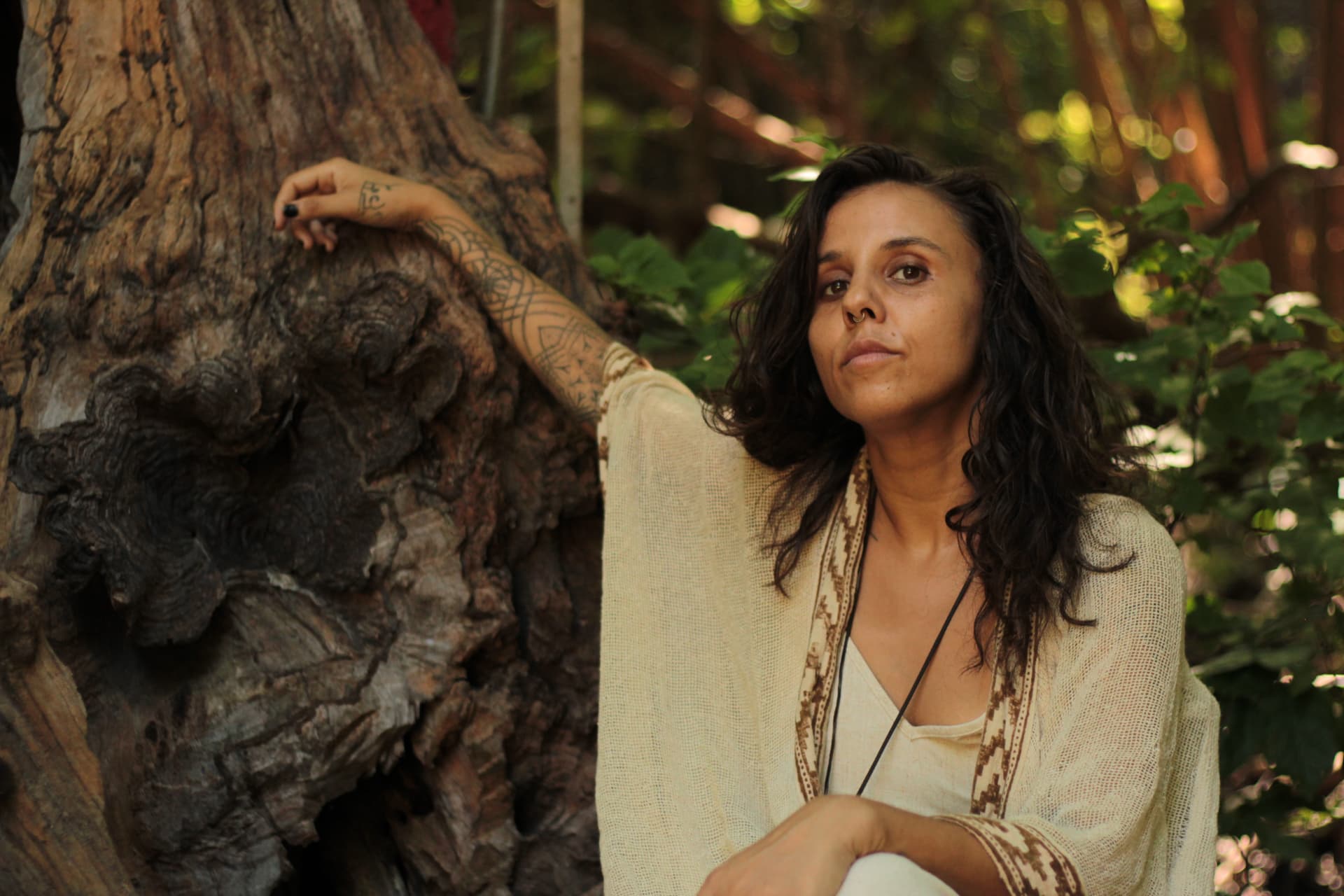 René in a forest setting, embodying the alchemist of her inner world